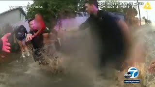 Dramatic bodycam video shows San Bernardino police rescue mother, 2 children from flash food | ABC7