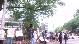 Protesters gather along University and Johnston Street in Lafayette following rally