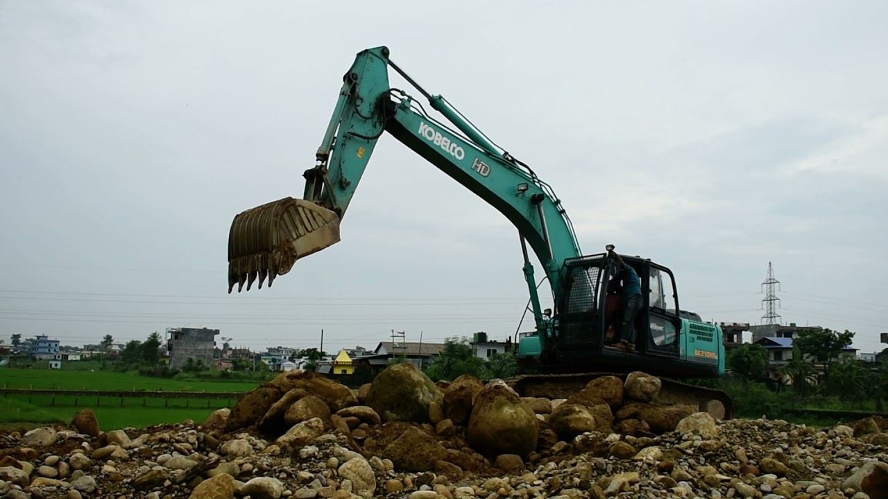 Excavator digging stone rock perfectly