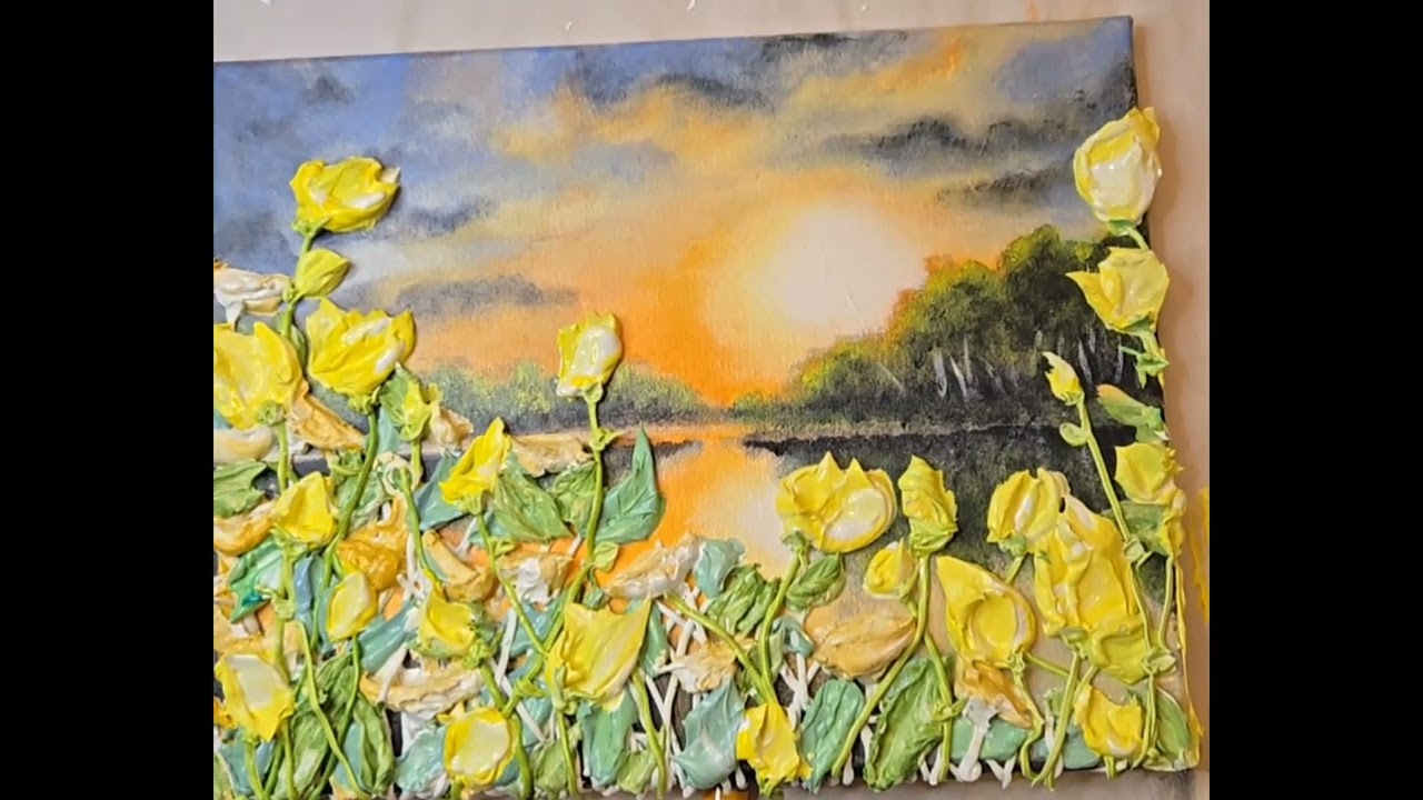 sunset with super thick yellow flowers framing a lakescape