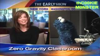 cookie monster laughs at news reporter