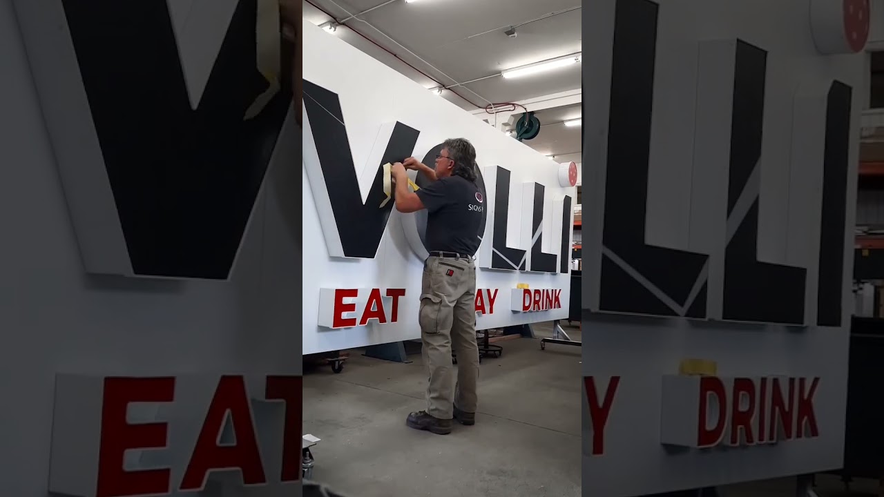 Night and day perforated vinyl graphics for Volli Pickleball sign. 