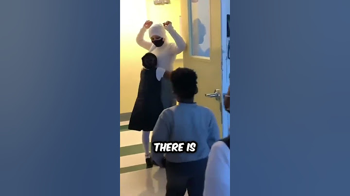 These students must hug the teacher to enter!
