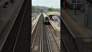SWR train arrives and departs Petersfield heading for london Waterloo