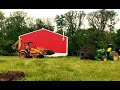 Transplanting a 8 foot Evergreen Tree with a John Deere Tractor!