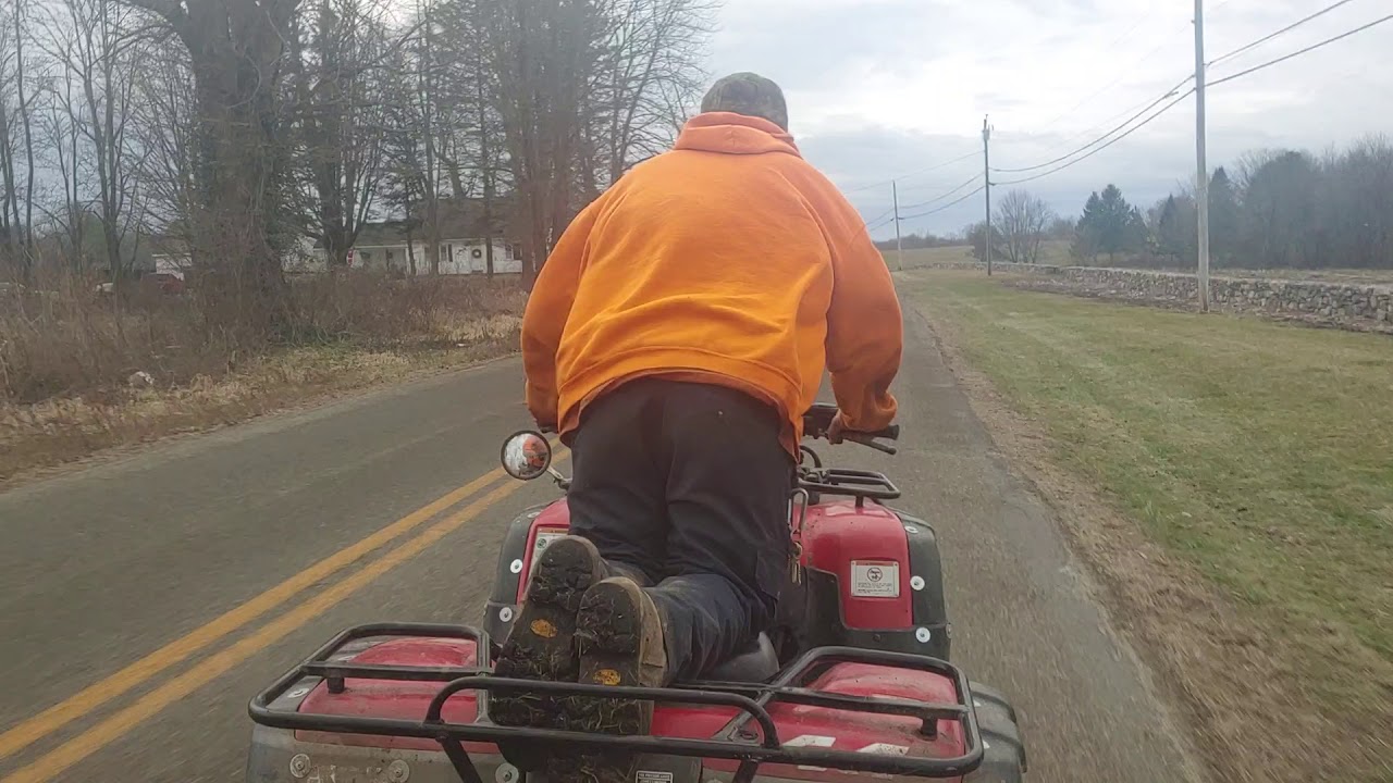 Honda Quad with chair trailer.