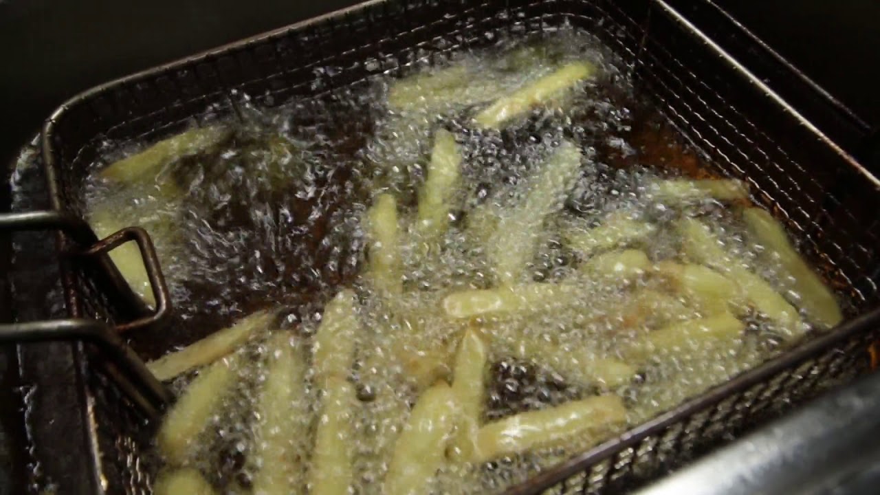 Deep Frying Cut Potatoes In Boiling Oil - YouTube