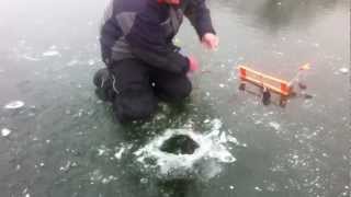 Giant Bass Caught Through The Ice!! Tip Ups Nov. 2012