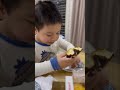 Cute baby loving donuts