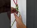 Lift the short rope this way.