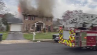 Firefighters battle house fire in Fairfax County