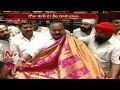 MLA Kamalakar sells sarees and earns Rs. 21,000