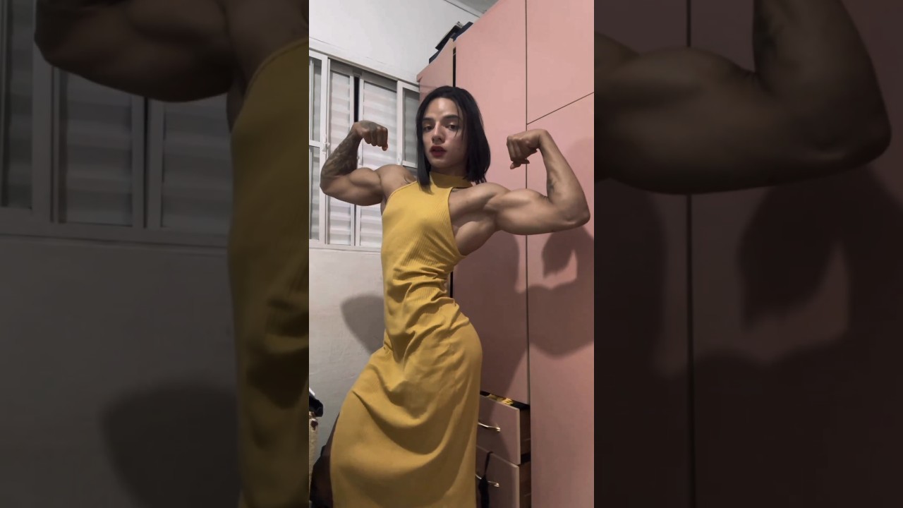 Sexy female bodybuilder's in dress posing - Isabella Sena