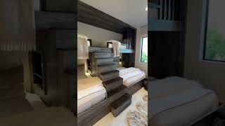 I love the layout of this bunk room and the larger size beds down below  seems so smart!