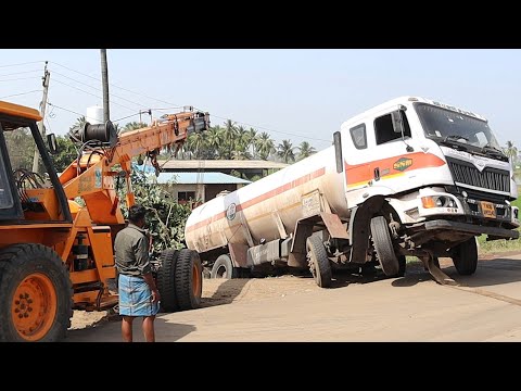 Petrol Tanker Truck Slip Off Highway - Truck Driver Struggling - Crane Help Driver to Rescue