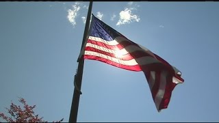 Why do we lower the flag to half-staff?
