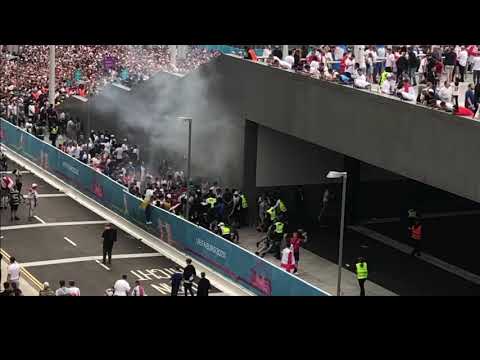 Fans storming a gate at Wembley - Italy v England.