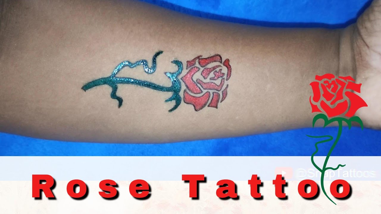 26 rose tattoo with pen 