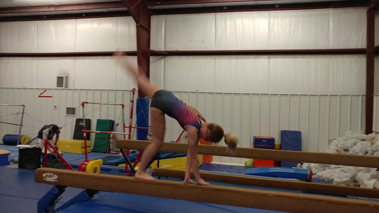 Claire doing walkover back handspring on beam YouTube