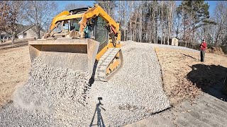 let’s build a gravel driveway and wood working shop pad, start to finish…