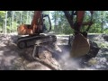 Excavator loading rock