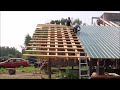 Laying Down More Roofing On Our Post And Beam Building.  Off Grid Homesteading.