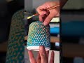 My start to finish process of stenciling and glazing a ceramic cup.