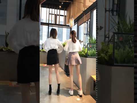 Two cute asian girl in a short skirt is dancing 10