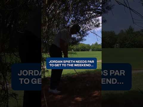 Needing par on his last hole, Jordan Spieth plays from the trees and drains the 24 footer.