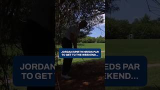 Needing par on his last hole, Jordan Spieth plays from the trees and drains the 24 footer.