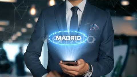 Businessman Smartphone Hologram Word Country Capital Madrid | Motion Graphics - Envato elements