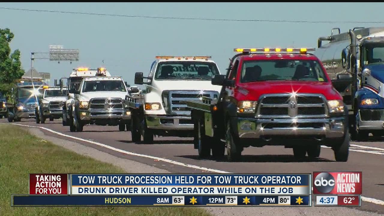 Tow truck procession held for tow truck operator killed on I-75 - YouTube