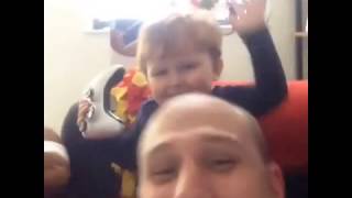 Young boy smacks his father on the top of the head, then ...