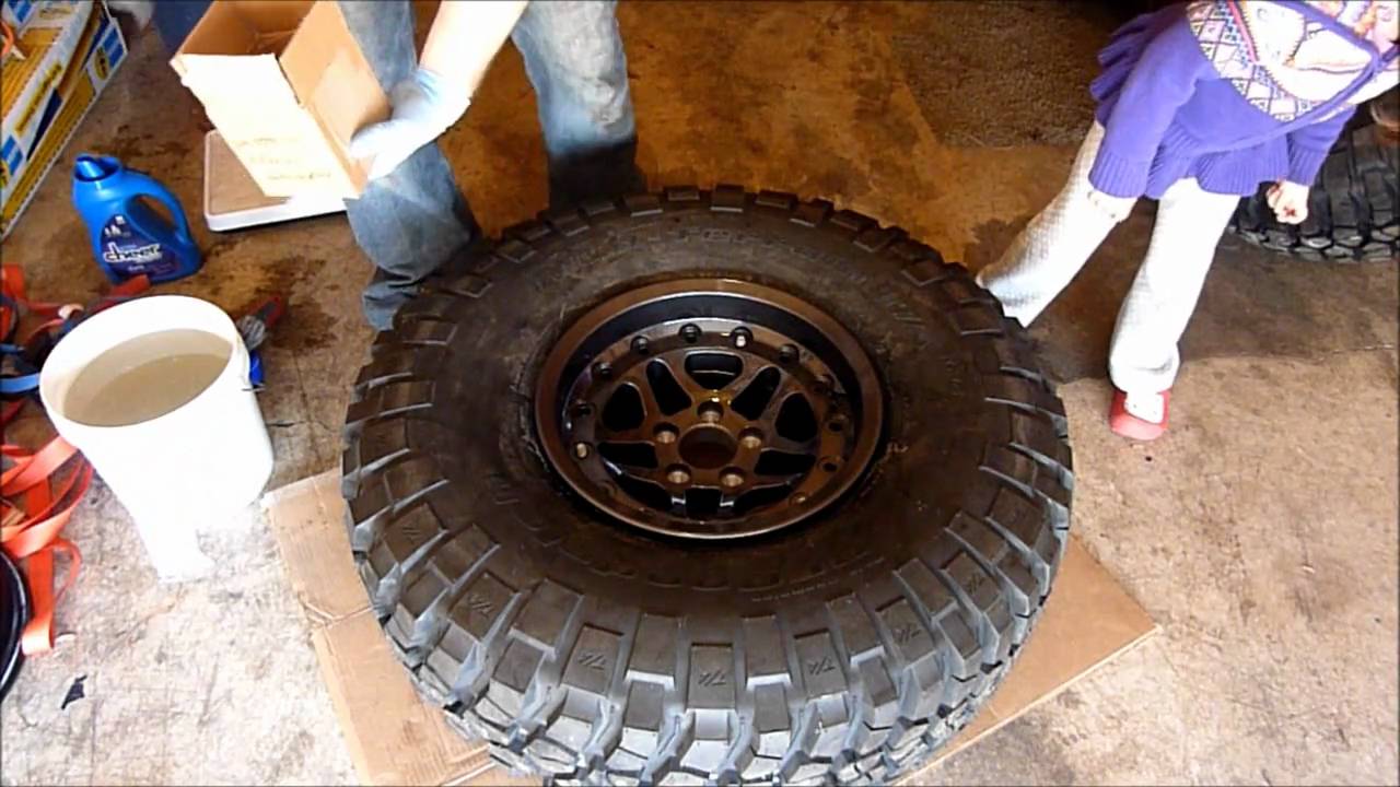 assembly of Hutchinson beadlocks and BFGoodrich MudTerrains for Jeep