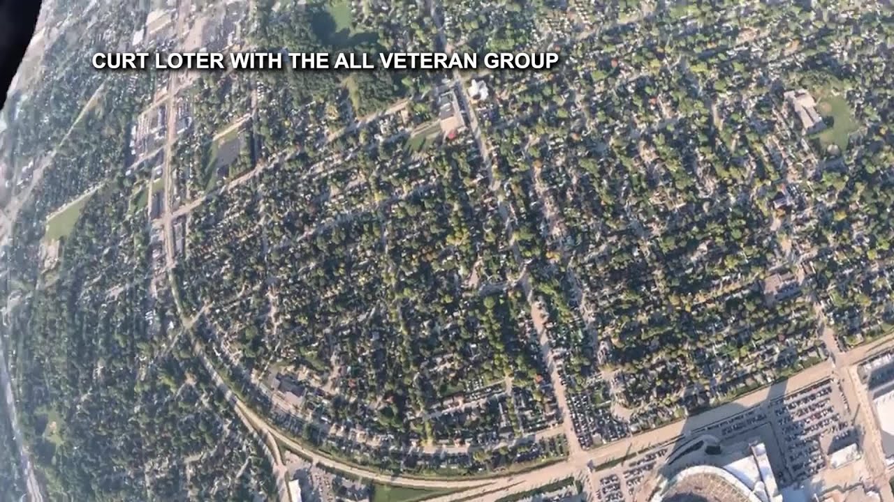 Curt Loter with the All Veteran Group parachuting into Lambeau Field