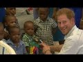 Prince Harry plays with children in Barbados