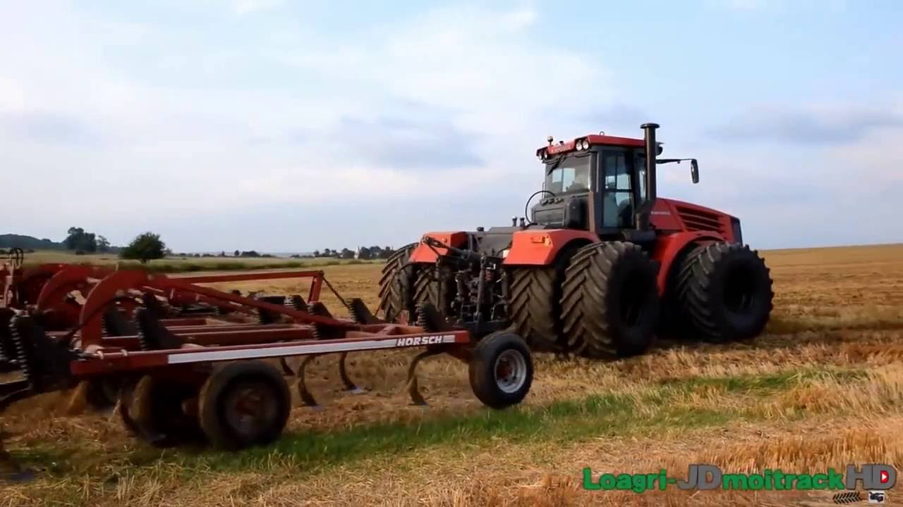 трактор Кировец на сдвоенных колесах с новой кабиной на культивации ...