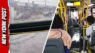 Water GUSHES into public bus during flooding in New York