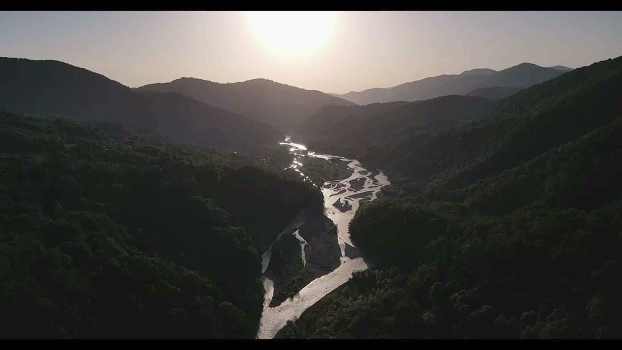 🚁 Aerial Splendor: Majestic Mountains and Serene River - Nature's Tranquil Masterpiece 🏞️🌊