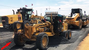 motor grader operator grading and cutting gravel foundation new road