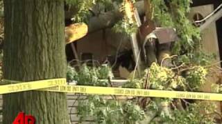Raw Video: Storm Knocks Tree Into Ind. House