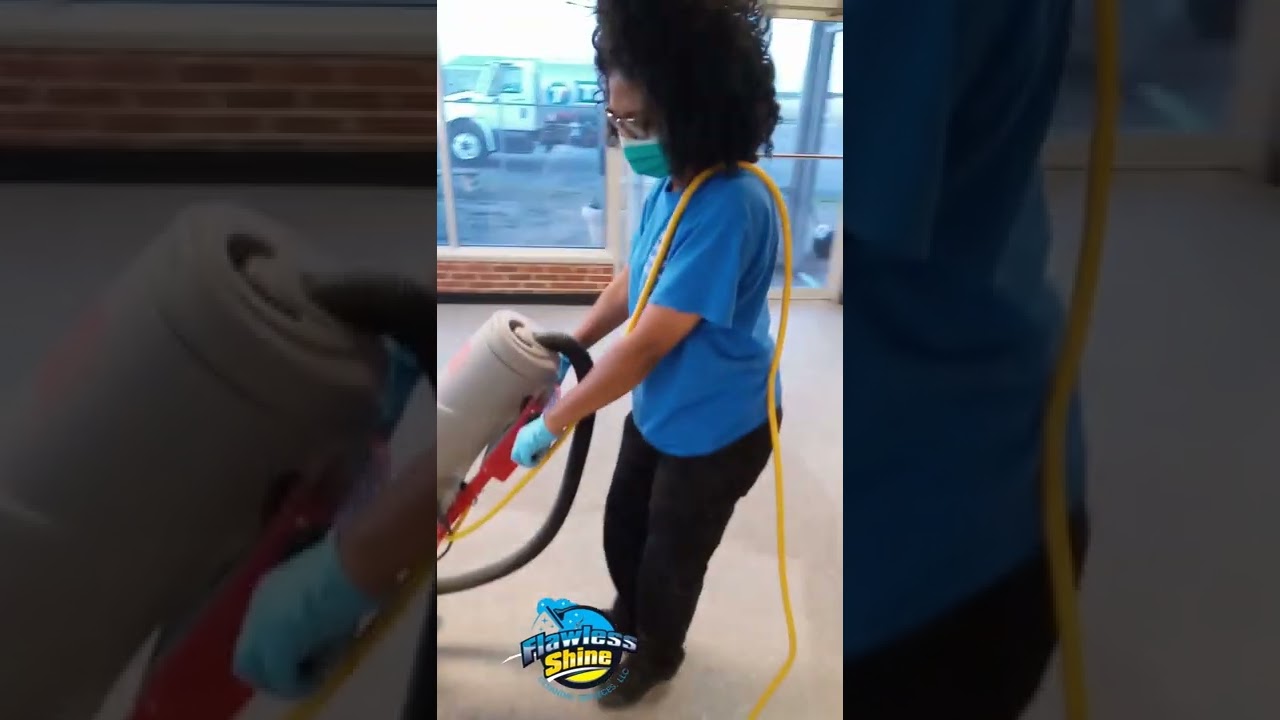 Dry stripping old dirty VCT tile floors.