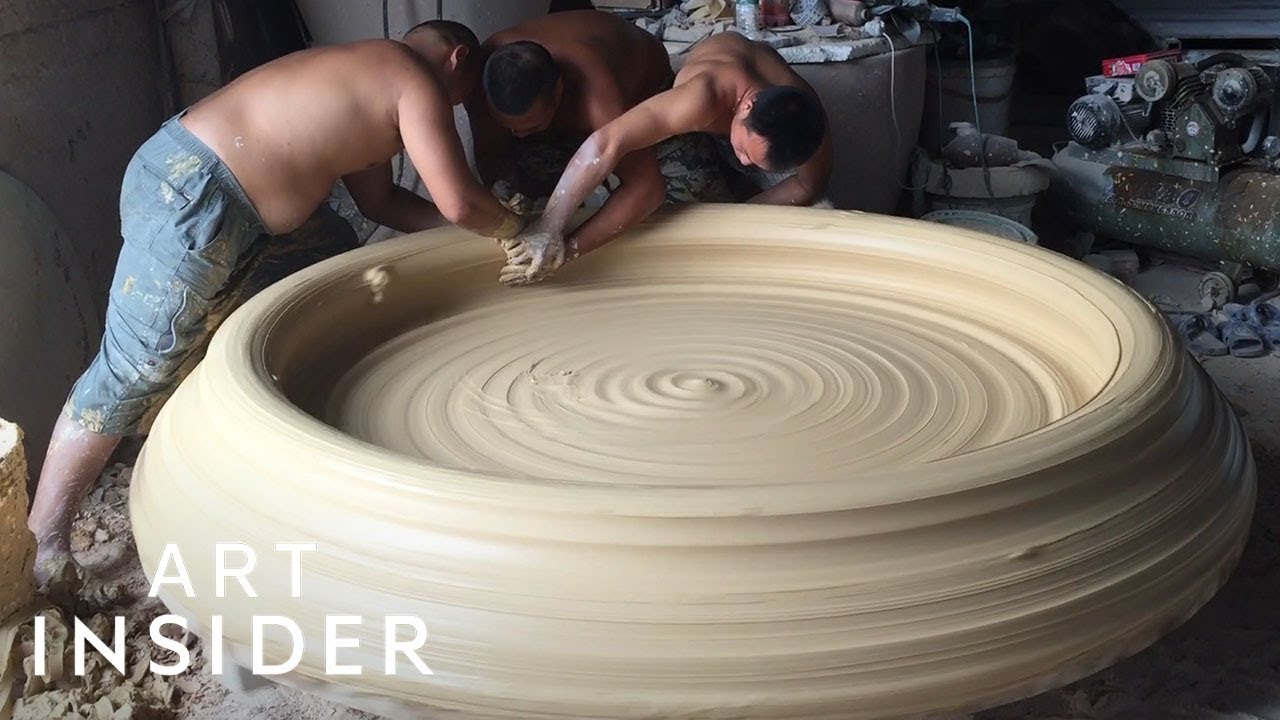 Man potterist making bowl on a potters wheel from clay in a