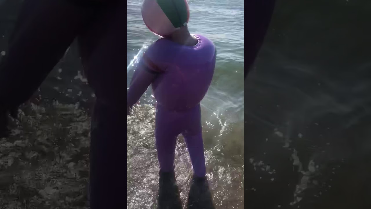 inflatable world At Wreck Beach in Vancouver wearing an inflatable plastic suit