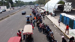 Thousands of Central American migrants pour into Mexican processing center on way to US