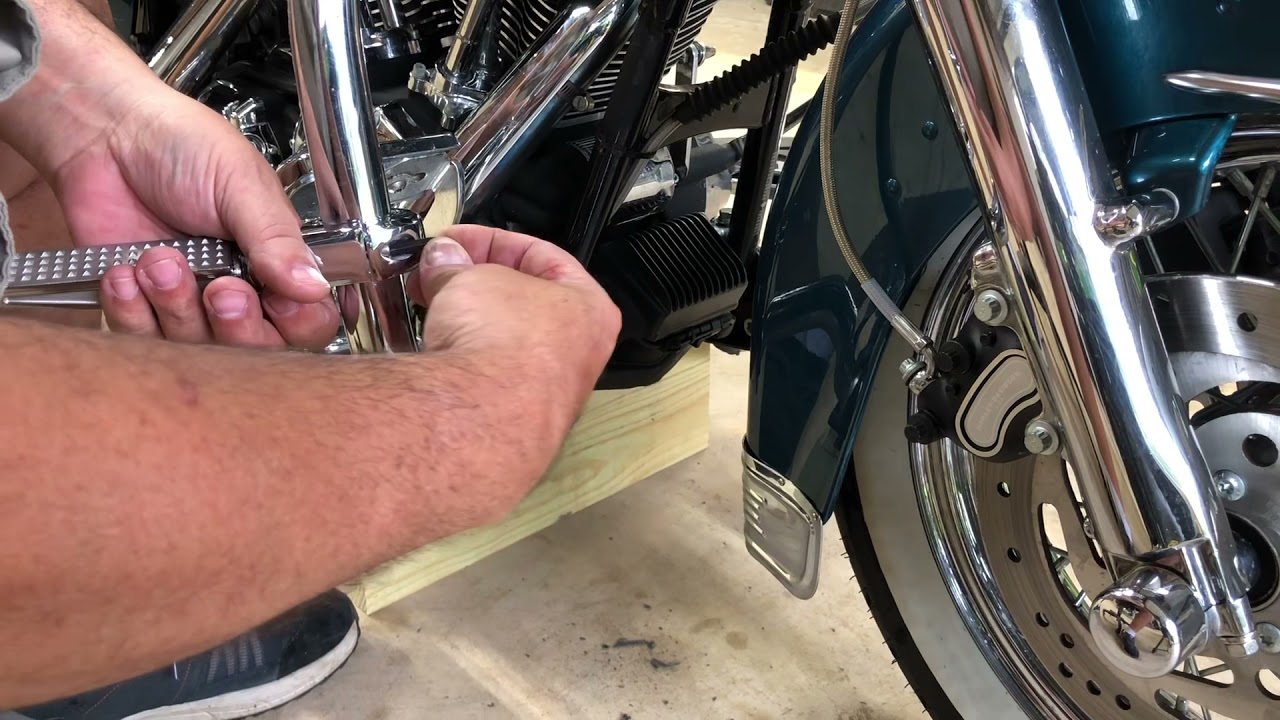 Installing foot pegs on my Harley Davidson. YouTube