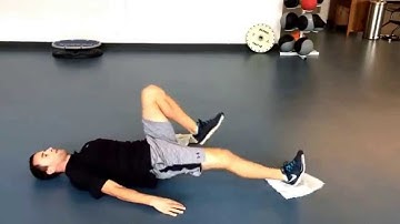 Towel single leg bridge with hamstring curl
