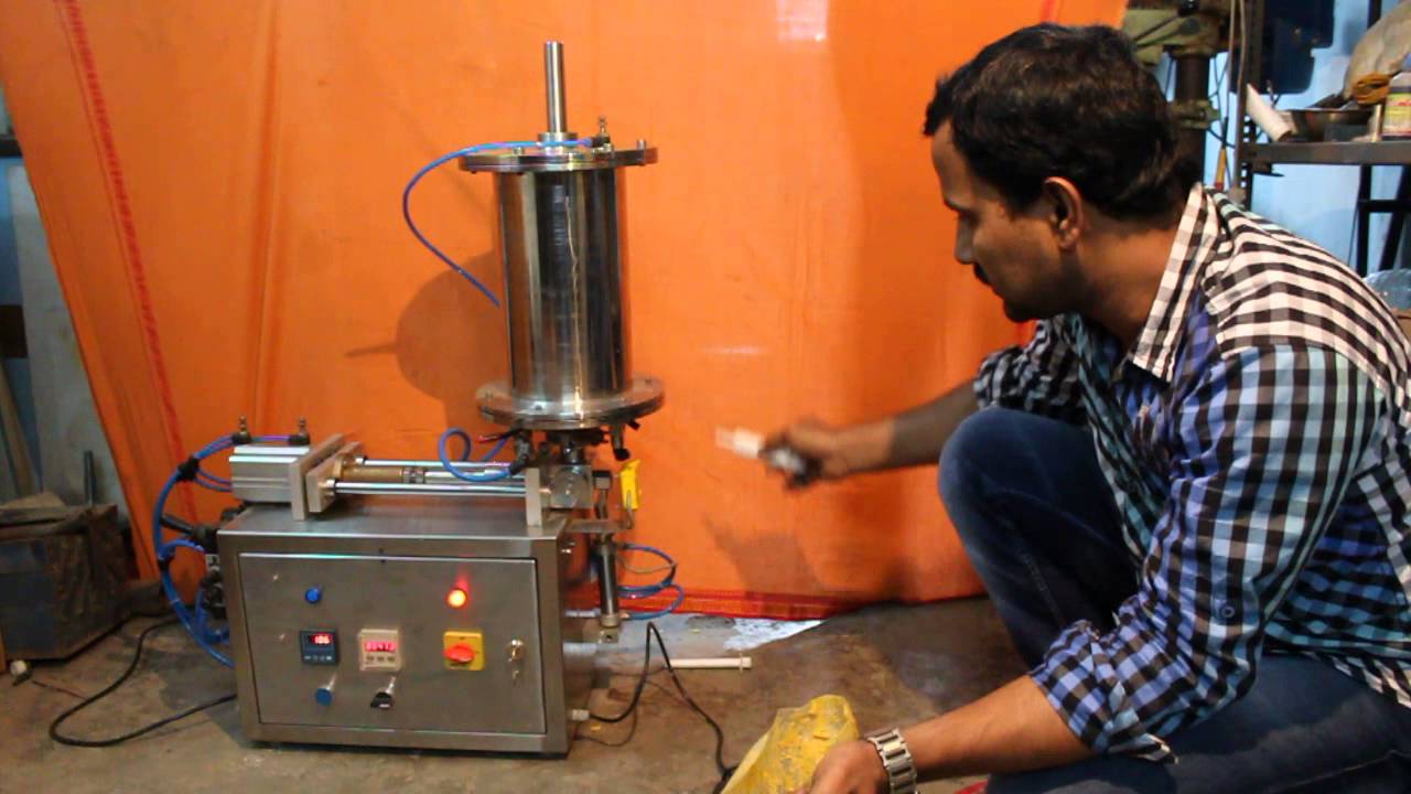 HARD PASTE SYRINGE FILLING MACHINE - YouTube