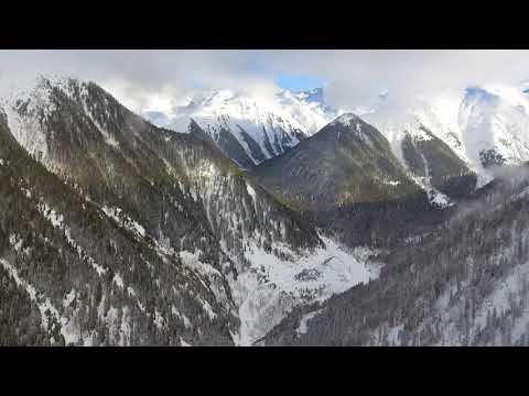 Free Background Upload videos flying over the snowy mountains
