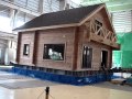 Log house on earthquake test